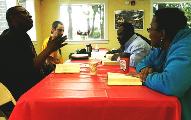 Former prisoner in solitary confinement, David Hudgens, left, teaches Bible study on Sundays.