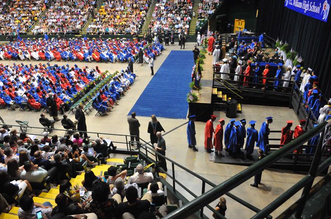 T.C. Williams principal Suzanne Maxey presents the diplomas.
