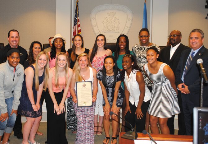 Paul VI’s championship girls basketball team with (back row, from left) Head Coach Scott Allen, Assistant Coach Parker Roach and Fairfax Mayor Scott Silverthorne.