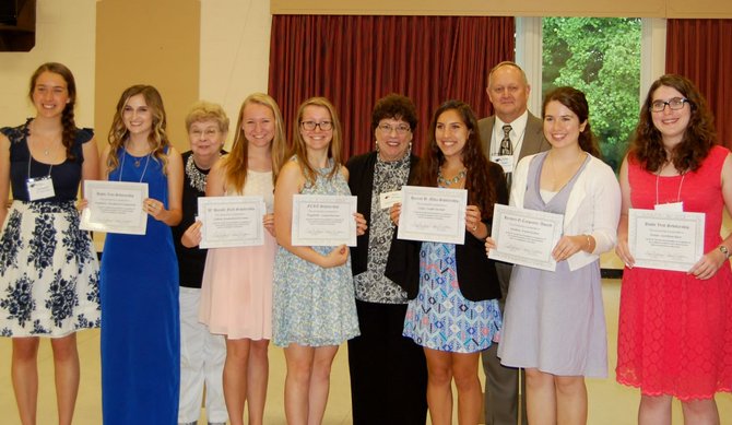 The recipients of scholarships from the Fairfax County Retired Educators gather at a luncheon honoring their accomplishments on June 12. All of these students have plans to obtain a teaching career and some are hoping to return to teach in Fairfax County. From left: Talia Schmidt, a recipient of last year’s scholarship, Kimberley Drummond, Billie Johnson, president of FCRE, Sydney Kirwan, Elizabeth McCune, Phyllis Rittman, Julia Gurdak, John Dent, incoming president of FCRE, Sandra Richie, and Anna Barr. Not pictured: Scholarship recipient Emily Colon. 
