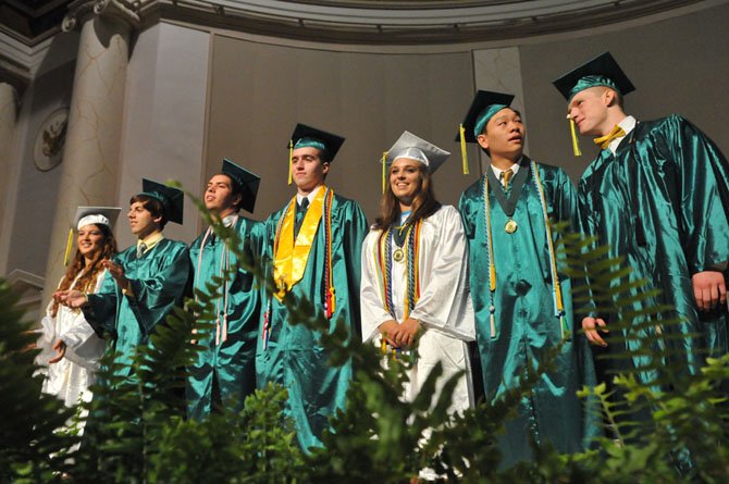 Senior SGA representatives Katharine Altman, Timothy Claude and Brian Plunkett join class officers treasurer Will Gent, secretary Courtney Cuppernull, vice president Edric Wung and president Jonathan Meyer on stage.