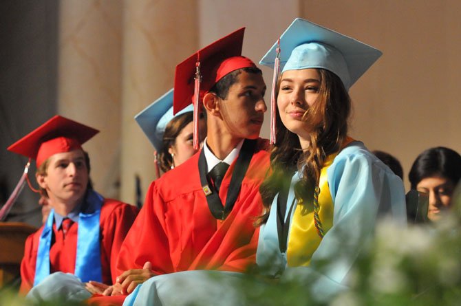 Marshall High School senior class officers Samuel Criscitello, Emma Heiden, Karim Saoud and Hayleigh Walton reflect as the Statesman Singers perform a musical selection.