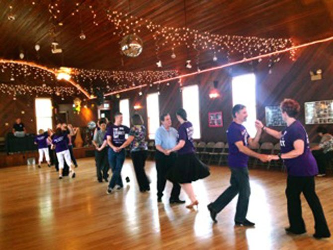 Attendees step and swing in memory of Elaine Krawitz.