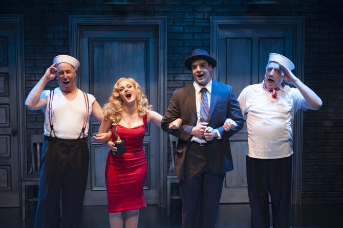 The Company (Christopher Bloch, Erin Driscoll, Doug Carpenter, and Ed Dixon) sings “The Best of Times (Reprise)” in “Cloak and Dagger,” now playing at Signature Theatre through July 6. 
