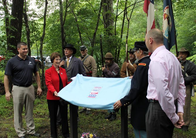 Officials unveil the Wolf Run Shoals Civil War Trails Marker at a dedication ceremony on June 21 in Clifton.
