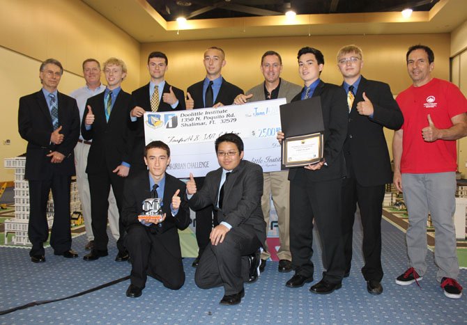 (Standing, from left) are teacher Emre Ege, an Air Force Research Center promoter, Jack Rizek, Philip Simpson, Calvin Rizek, Doolittle Institute President Mark Simpson, William Chang, Fairfax’s team leader and programmer Thomas Dabney, and a Doolittle Institute volunteer; (front row, from left) are Paul Huravitch and Francis Winn.