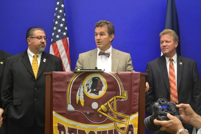 State Sen. Chap Petersen (D-Fairfax – center), stands with Republican Delegates David Ramadan of Loudoun (left) and Jackson Miller (Manassas) right, during a news conference at the Capitol in Richmond Monday, June 23, announcing the formation of the "Redskins Pride Caucus."
