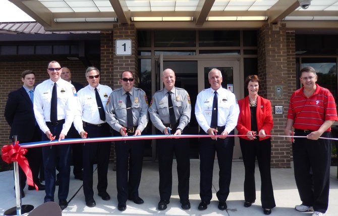 About to cut the ribbon are (from left) Station 21 Volunteer Chief Jack May and Volunteer Deputy Chief Jonathan Wood, Police Capt. John Naylor Jr., Police Chief Ed Roessler Jr., Fire Chief Richard Bowers, Supervisors Chairman Sharon Bulova and Sully Supervisor Michael Frey.
