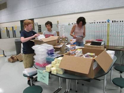 On Aug.13, 2013, Our Daily Bread volunteers sorted supplies that were purchased with donations from community members for ODB's 2013 Collect for Kids Back to School Program. The non-profit is seeking donations of cash, backpacks and calculators through Aug. 8, 2014 in hopes of assisting 2,000 needy children in the Fairfax High School and JEB Stuart High School pyramids this fall. 
