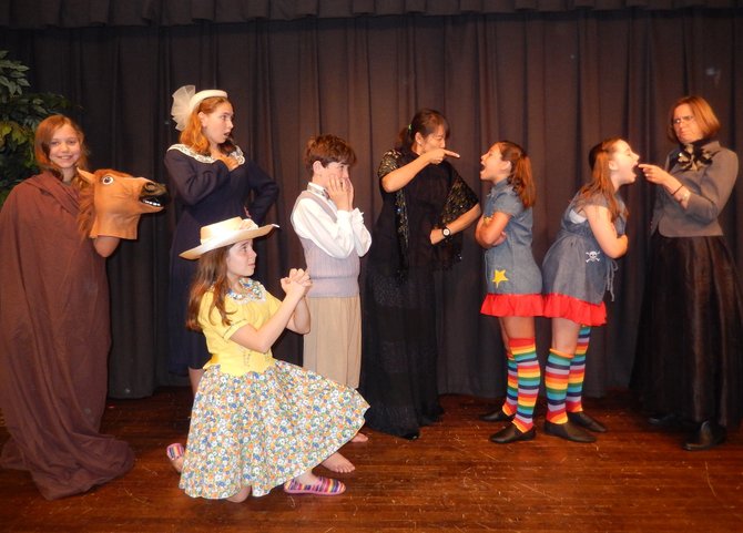 Posing in character are (standing, from left) Lizzie Bayer, Sierra Hoffman, Owen Grannis, Sharon Petersen, Bella Lanoue-Chapman, Maggie Slivka and Judy Zakreski, and (kneeling) Lourdes Navarro.