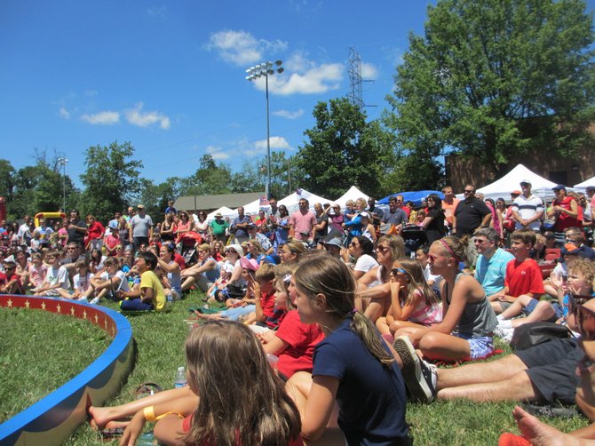 Caffi Field, alongside the Vienna Community Center, was blanketed with kids and growns-ups watching and applauding the Old Bay Circus Show performers. The weather was sunny and dry, enticing folks to stay awhile.