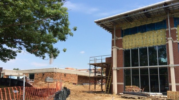 The old Jefferson-Houston School, at left, will be demolished in the next few weeks after the new school, at right, opens its doors.