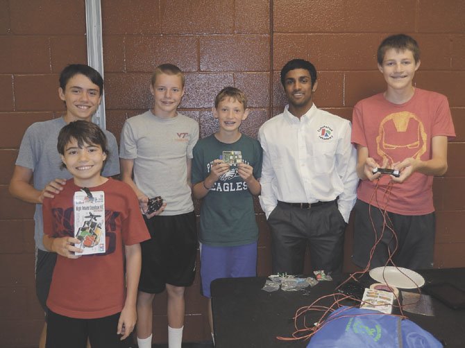 Participants in the computer camp included (back row, from left) Nathan Spivy, Matthew Wright, Will Covey, teacher Bijoy Thomas and Daniel Wright; in front is Ben Spivy.