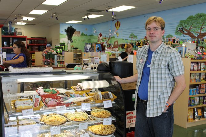 Matt O’Leary, an employee at the natural pet food store Felix & Oscar in Springfield, stands by the store’s wide selection of fresh treats for dogs and cats.