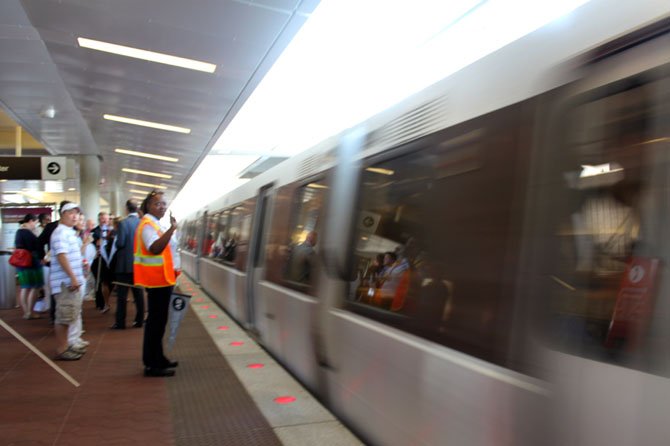 The first public Silver Line rail cars leave the Wiehle-Reston East station.