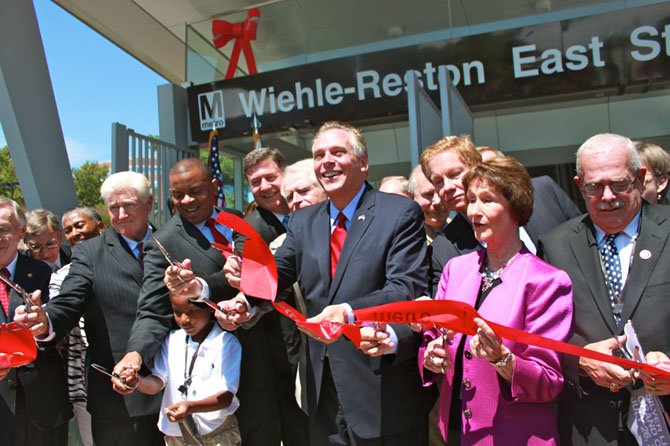 Local, state and national officials at the ribbon-cutting ceremony for the Silver Line on Saturday.