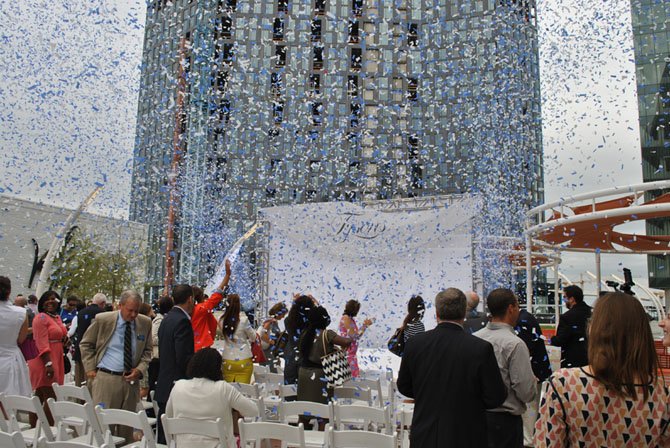 Confetti cannons blast after the dedication for the Tysons Corner Center Plaza on July 24.