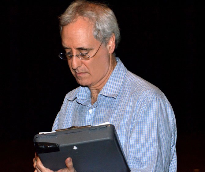 Robinson Director Chip Rome taking notes during a rehearsal.