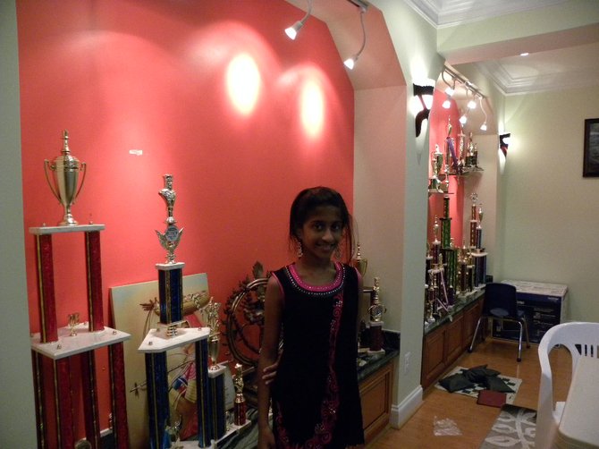 Aasa Dommalapati has won many chess tournaments. Her father, Anand, displays both of his children’s trophies in the basement.
