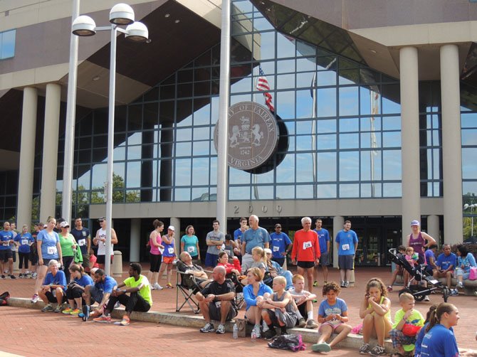 Runners and supporters gather around for the awards ceremony after the 5K and Fun Run.
