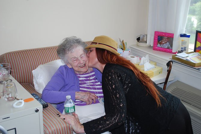 Whitney Knoerlein kissing her grandmother, Roberta 'Cis’ Sigholtz, a gold star mother of McLean.