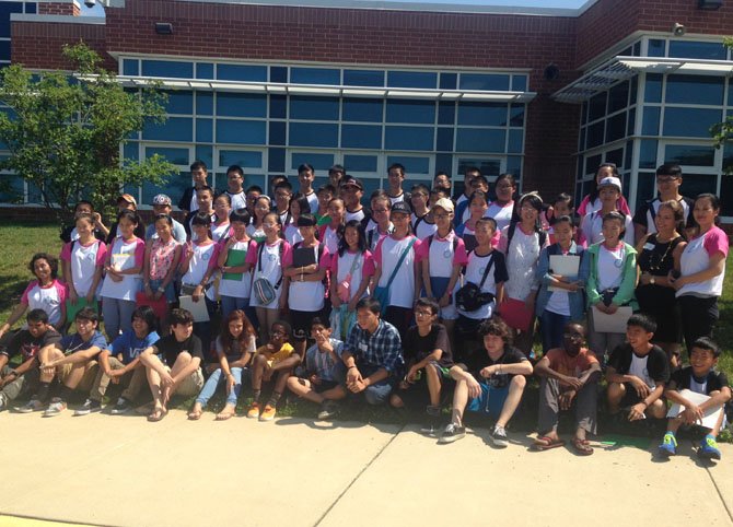 Group photo of Chinese students at Lanier Middle, with the student tour guides in the front row.
