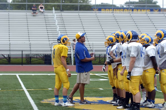 First-year Robinson head coach Scott Vossler talks to the Rams during a recent scrimmage.