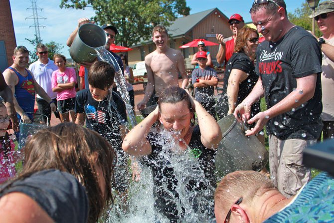 Mayor Lisa Merkel gets drenched during the ALS Ice Bucket Challenge.
