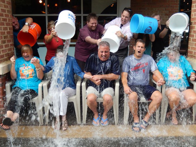 Board of Supervisors Chairman Sharon Bulova gets drenched. (From left) are Jo Ormesher, Sharon Bulova, Scott Silverthorne, Chap Petersen and Beverly Myers. Petersen’s daughter, Eva, a Fairfax High sophomore, had the honor of dousing her dad with ice water.
