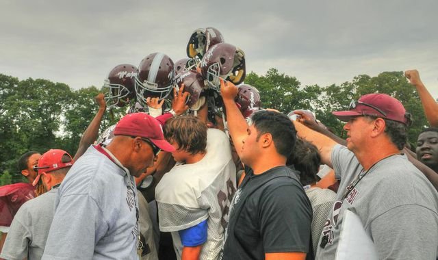 Head coach Barry Wells, left foreground, and the Mount Vernon football team will open the 2014 season against Edison on Aug. 28.