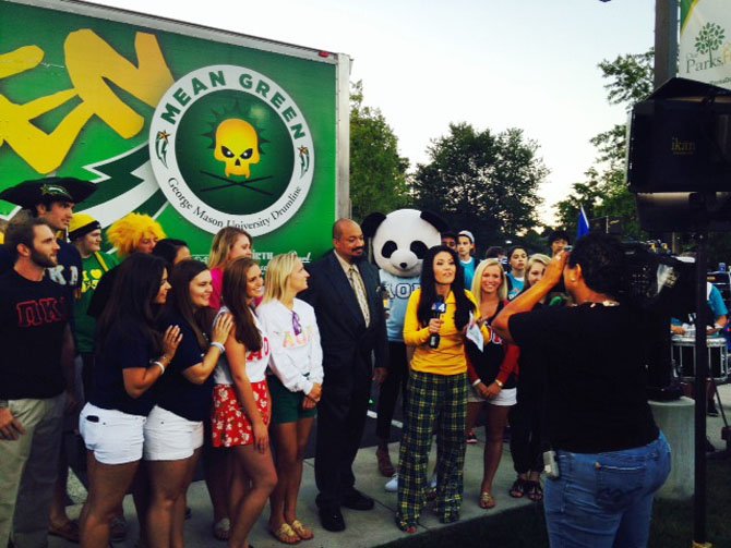 Mason alumna and News4 reporter Angie Goff interviews Mason's Doc Nix and Greek Life members as dawn breaks in Fairfax. 
