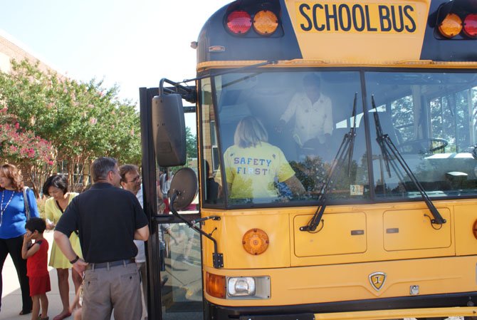 Kindergarten students take their first bus ride around the neighborhood.