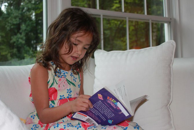 Alina Bujnowski, 5, has read more than 130 books this summer by herself.