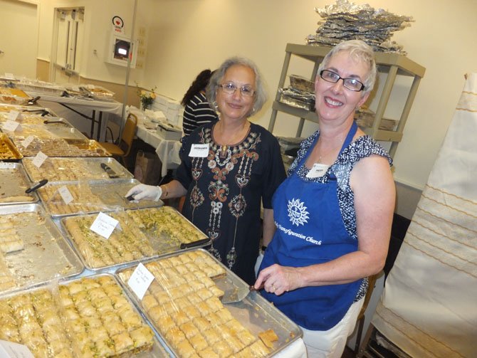 Holy Transfiguration Melkite Greek-Catholic Church volunteers sell sweets hand-made by church members. The festival will sell 12,000 pieces of sweets over the two-day festival on Labor Day weekend.