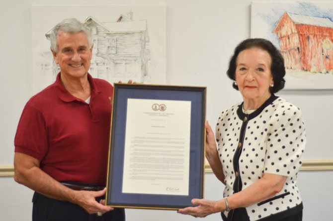 Delegate Tom Rust (R-86) holds a resolution recognizing lifelong Herndon resident Elma Mankin who turns 90 this August.
