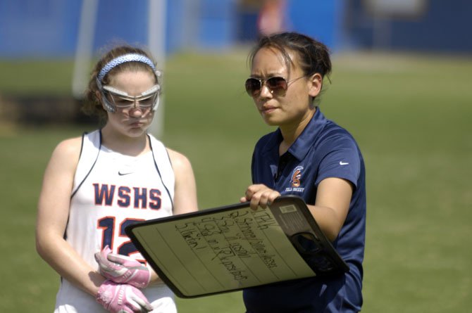 First-year West Springfield field hockey head coach Tina Nham, right, and sophomore Marie Laverdiere are seen during the Under the Lights tournament at Lee High School.