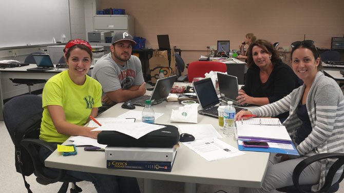 From Left. Irving’s Civics teachers, Sarah Titus, Dave Dachille, Amy Jackson and Victoria Nelson sat down together to plan out the eighth grade Honors Civics curriculum for the 2014-2015 academic year.