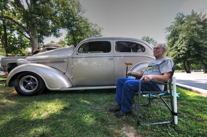 Dan Hughes with his 1937 Dodge 2-door touring sedan. Hughes purchased the car in 1982 and spent a year restoring it.