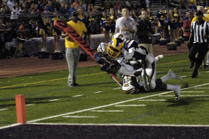 Robinson running back Marcus Denham dives into the end zone for a second-quarter touchdown against Lake Braddock on Friday night.