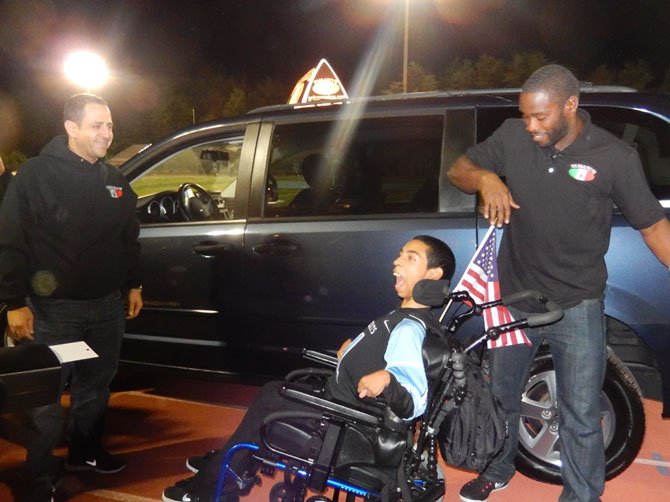 From left: Fouad Qreitem and Pierre Garçon happily watch Juwaan’s excitement.