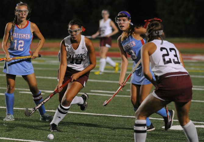 Mount Vernon junior captain Jessica Miller (18) works her way through Marshall defenders during their Sept. 15 contest at Mount Vernon High School.