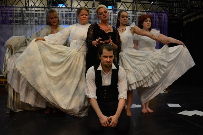 (Top, from left) Mary Payne Omohundro, Kristen Jepperson, Karissa Swanigan, Barbara Lawson and Kathleen McCormack escort Edgar Allen Poe (Christopher Shaw, bottom) towards the afterlife.
