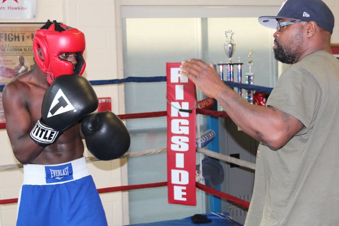 Dennis Porter trains Troy Isley, National Olympic Junior Gold Medalist.