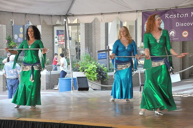 Members of Troupe Eshveh, a Sterling-based dance ensemble specializing in Middle Eastern dance, perform on the world stage at a past Reston Multicultural Festival.
