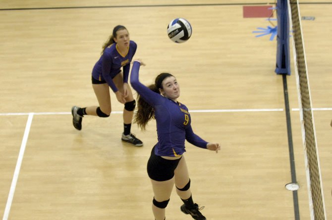 Lake Braddock junior Faith Briden rises up for a kill attempt during the Rebel Volleyball Invitational on Sept. 20 at Fairfax High School.