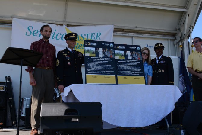 From left: Mount Vernon school board member Dan Storck, CSM Scott Guillory, Ashley Behrens (USHII and MVL Chamber of Commerce) and Fort Belvoir Garrison Commander Col. Michelle Mitchell standing with the renewed Army Community Covenant. 
