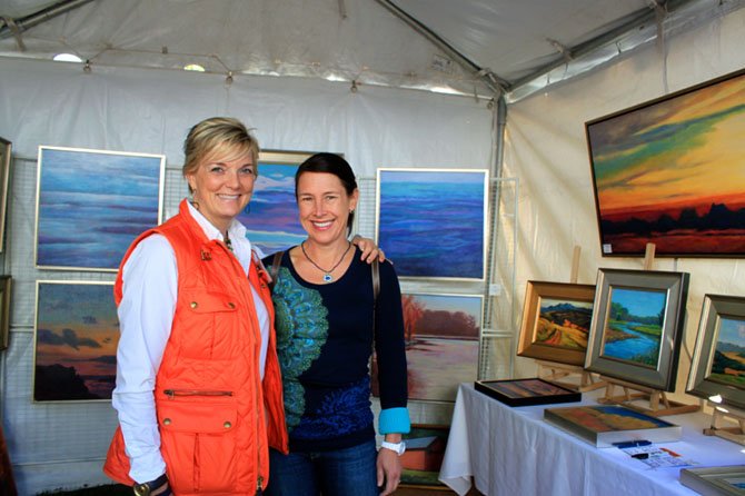 Artist Julie Lansaw and a client Catherine McCarthey, McLean, at the MPAArtFest on Sunday.
