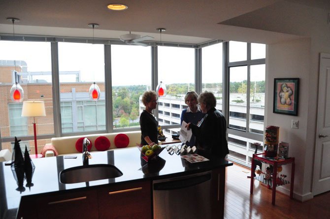 Guests on the Reston Home Tour enjoy the view in the kitchen of the home of Carl and Marsha Swerdloff, one of the stops on the Reston Home Tour last year.
