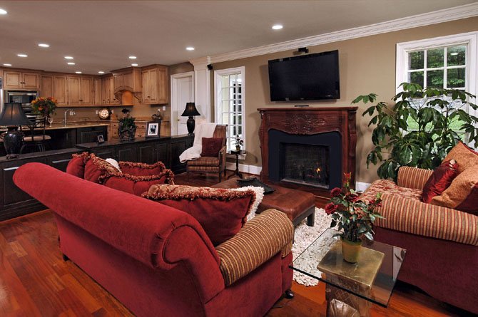 Remodeler Ted Daniels added 2,000 square feet to his personal residence on Hunting Horse Drive and reconfigured the first floor to include a comfortable family room adjacent to a large gourmet kitchen. Daniels had purchased the cherry wood mantle years before he knew where he would use it.