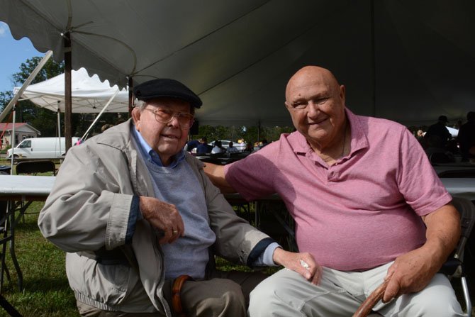 Fifty-two-year Mount Vernon resident John I. Morton (left) and Mount Vernon District Supervisor Gerry Hyland (right) catch up under the tent on Justice Snowden Farm. “A man from Maine came down and taught us how to do it,” said Morton. “We thought it would be a good fundraiser, and it has been. I’ve been to every damn one of ‘em.”
